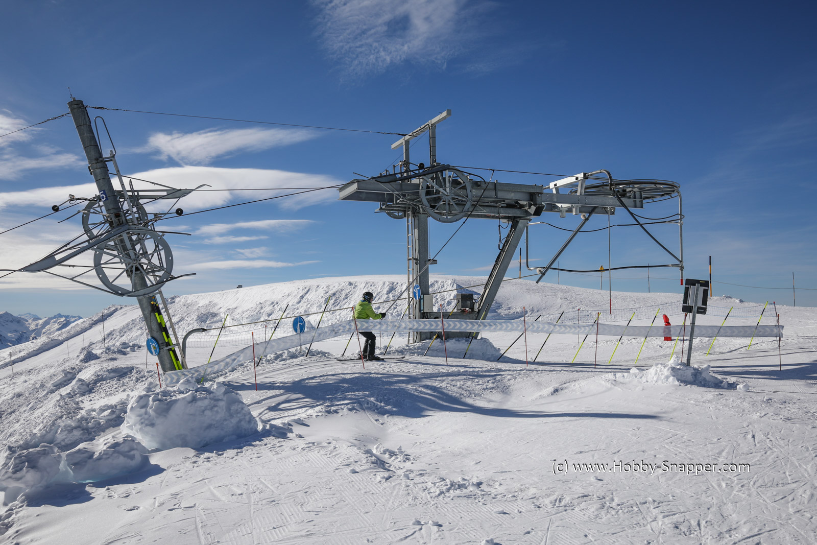 Photo Image Of: A skier arriving at the top of the Veleray drag lift